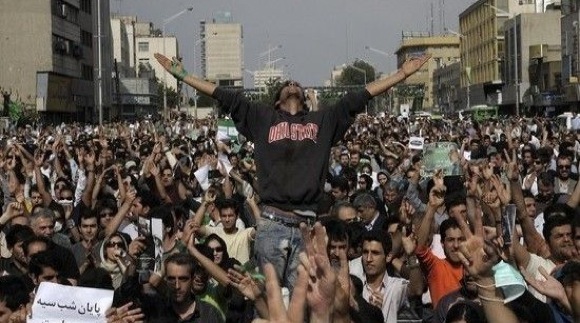 A supporter of defeated Iranian presidential candidate Mir Hossein Mousavi gestures during a rally in Tehran on June 15, 2009 (AFP/Getty Images).